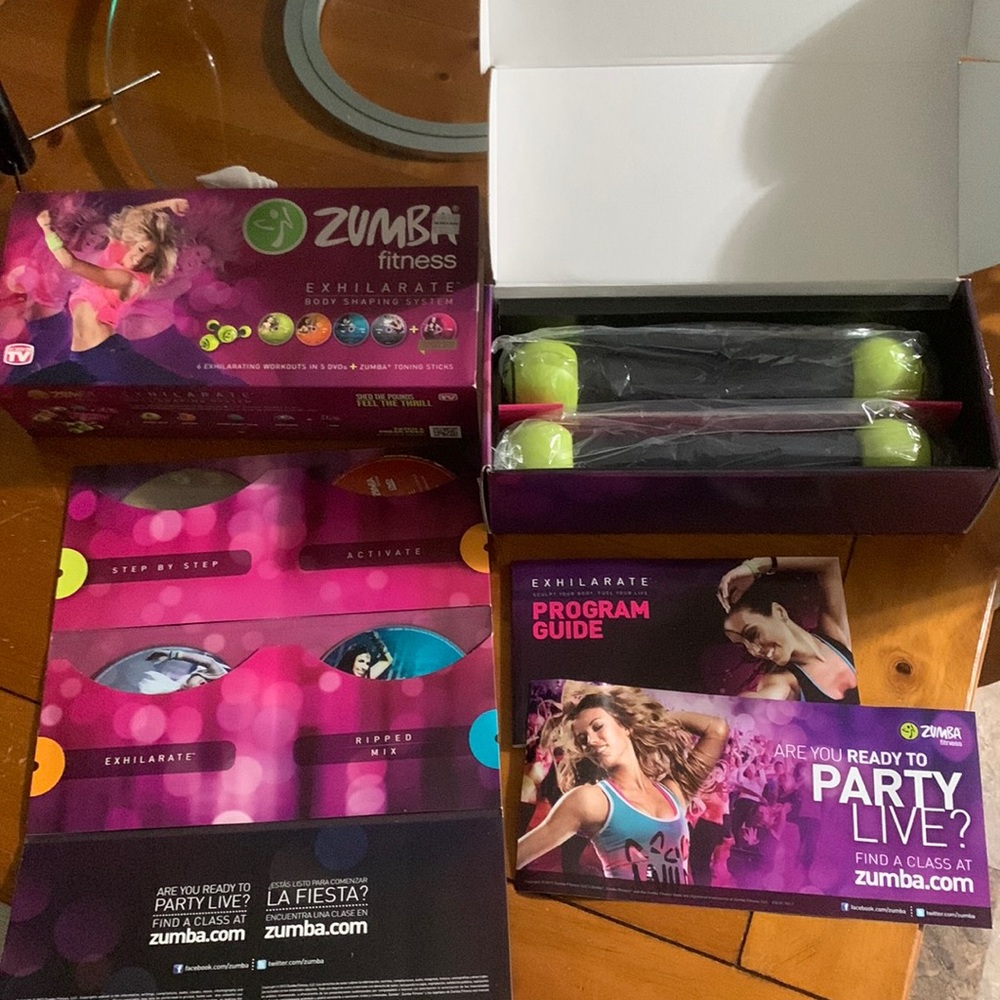 Zumba Fitness Exhilirating workouts in 5DVSs + Zumba toning sticks